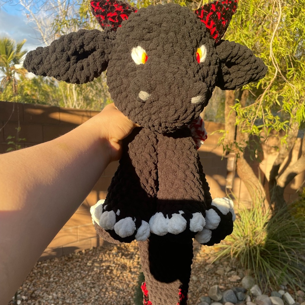 Crochet dragon snuggler red and black baby plush with no stuffing in body